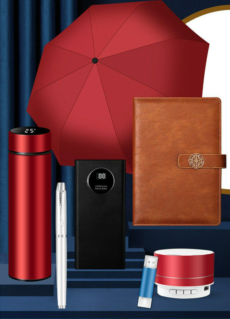 Coffret cadeau d'entreprise personnalisé 7-en-1. Il comprend une banque d'alimentation de 10 000 mAh avec affichage numérique, un thermos, un carnet de notes et un parapluie.